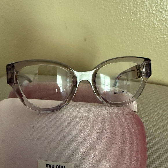 Miu Miu Transparent Glasses with Gold Accents
